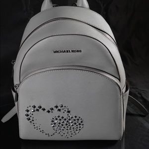 silver Michael Kors studded double heart backpack